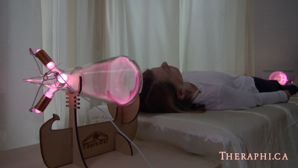 Person lying down receiving full body Theraphi treatment